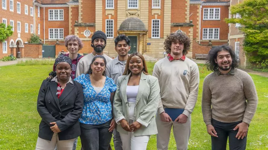 Vee Kativhu and Astrophoria Foundation Year Students standing in the main quad at Lady Margaret Hall College