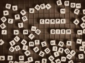 Dice with letters spelling out Carpe Diem
