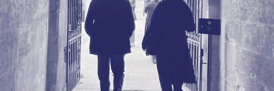 Two young people walking through an Oxford college gate into a courtyard, overlaid with purple Astrophoria Foundation Year graphics.